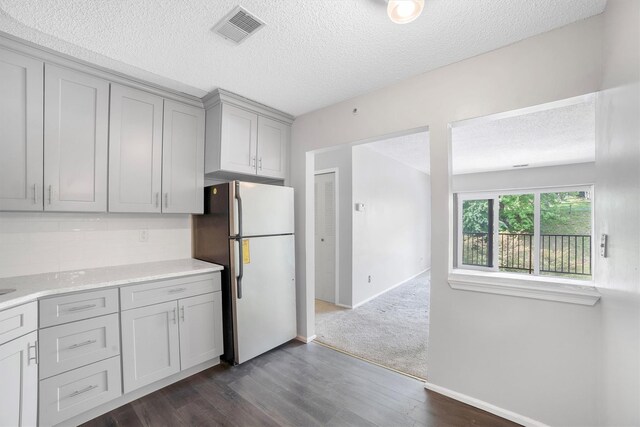 32 Huntington Cir Building 19, Peekskill, NY 10566 - kitchen featuring freestanding refrigerator, gray cabinetry, a textured ceiling, dark wood finished floors, and light countertops