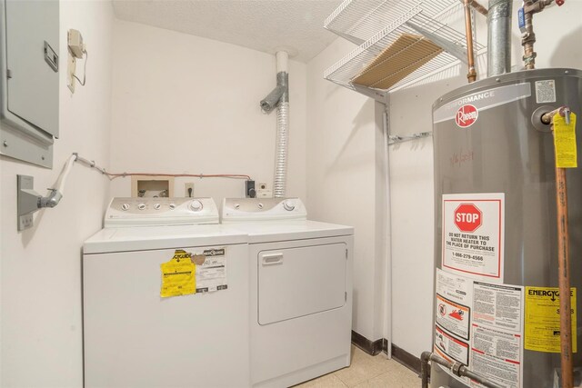 32 Huntington Cir Building 19, Peekskill, NY 10566 - laundry room with water heater, washer and clothes dryer, and light tile patterned floors