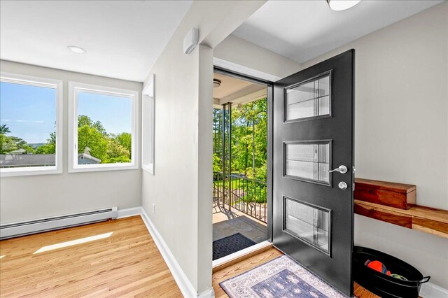 530 N Midland Ave N, Nyack, NY 10960 - foyer entrance with a baseboard heating unit, wood finished floors, healthy amount of natural light, and baseboards