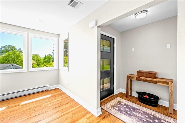 530 N Midland Ave N, Nyack, NY 10960 - foyer featuring baseboard heating, wood finished floors, and baseboards