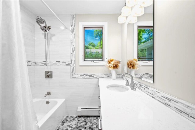 530 N Midland Ave N, Nyack, NY 10960 - bathroom featuring baseboard heating, shower / tub combo with curtain, vanity, a chandelier, and tile walls