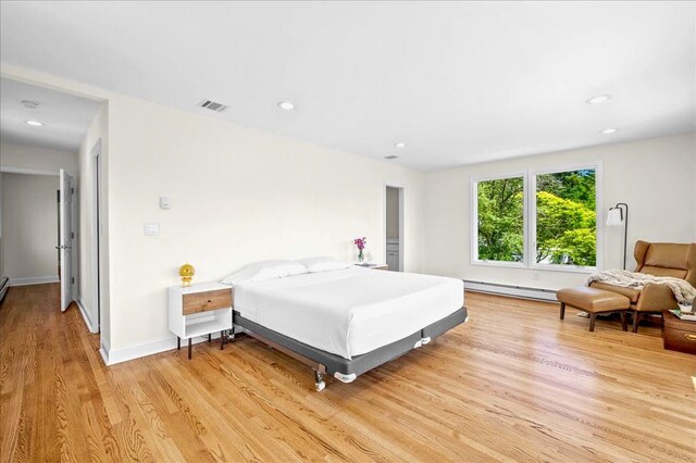 530 N Midland Ave N, Nyack, NY 10960 - bedroom with a baseboard radiator, light wood finished floors, recessed lighting, and baseboards