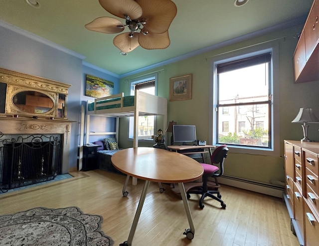 229 W 138th St, New York Manhattan, NY 10030 - home office featuring baseboard heating, healthy amount of natural light, crown molding, and a fireplace with flush hearth