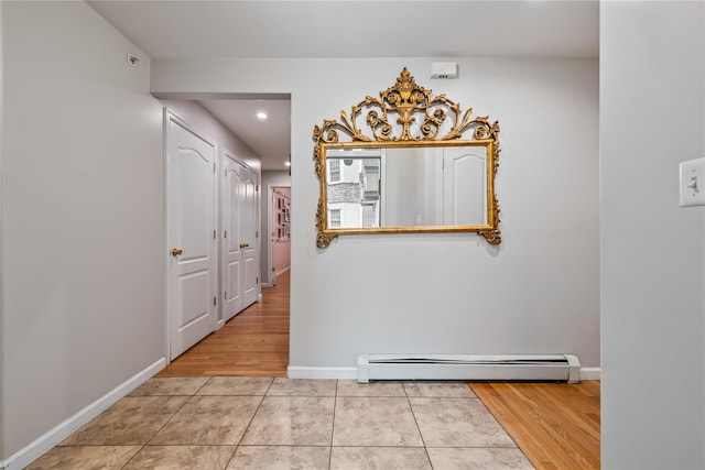 12 Horizon Ct Unit 103, Monsey, NY 10952 - hallway featuring a baseboard heating unit, recessed lighting, light tile patterned floors, and baseboards
