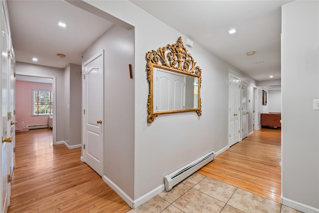 12 Horizon Ct Unit 103, Monsey, NY 10952 - hall with a baseboard radiator, a baseboard heating unit, recessed lighting, light wood-style floors, and baseboards