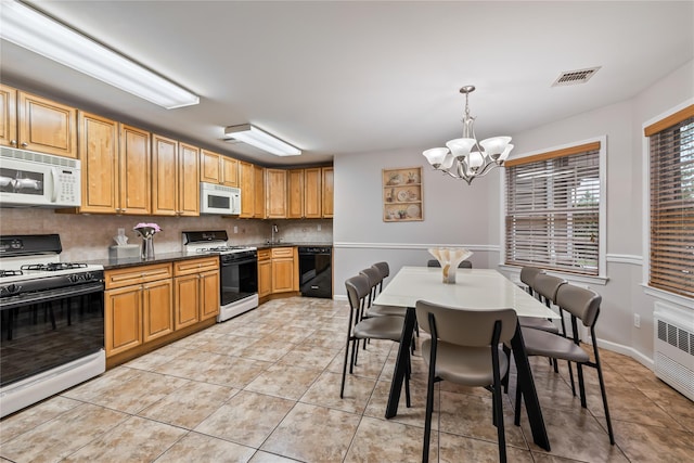 12 Horizon Ct Unit 103, Monsey, NY 10952 - kitchen featuring white appliances, a chandelier, decorative backsplash, dark countertops, and light tile patterned floors