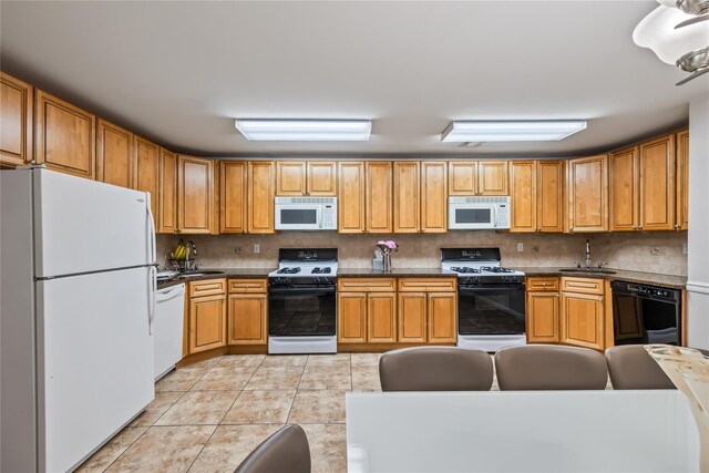 12 Horizon Ct Unit 103, Monsey, NY 10952 - kitchen featuring white appliances, a sink, and dark countertops