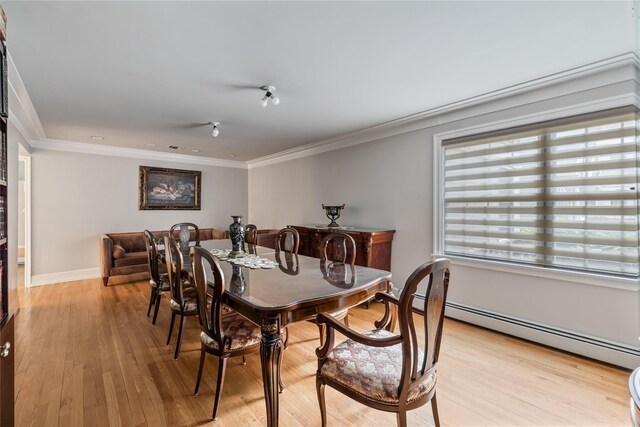 12 Horizon Ct Unit 103, Monsey, NY 10952 - dining area with light wood-type flooring, crown molding, a baseboard heating unit, and baseboards