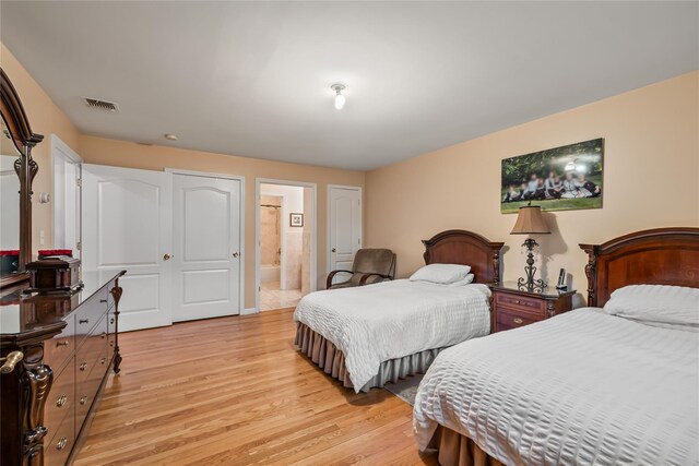 12 Horizon Ct Unit 103, Monsey, NY 10952 - bedroom with light wood-style floors and ensuite bath