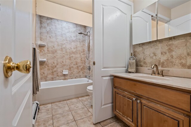 12 Horizon Ct Unit 103, Monsey, NY 10952 - bathroom with toilet, vanity, tub / shower combination, a baseboard heating unit, and tile patterned flooring
