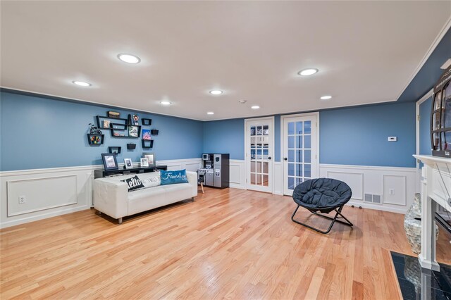 12 Horizon Ct Unit 103, Monsey, NY 10952 - living area featuring a decorative wall, recessed lighting, a wainscoted wall, light wood-style flooring, and french doors