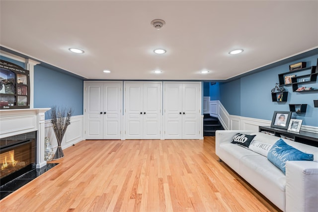 12 Horizon Ct Unit 103, Monsey, NY 10952 - living room featuring wainscoting, a decorative wall, light wood-style flooring, recessed lighting, and a fireplace