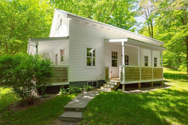 back of house with a yard and a wooden deck