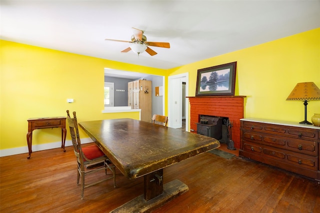 dining area with hardwood / wood-style flooring, ceiling fan, and baseboards