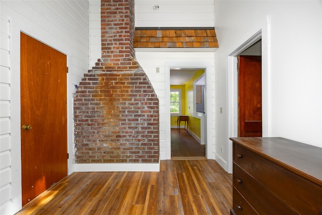 entrance foyer with wood-type flooring and baseboards