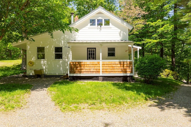 view of front of home with covered porch and metal roof