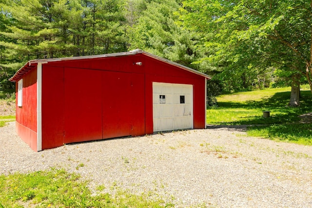view of outbuilding featuring a forest view