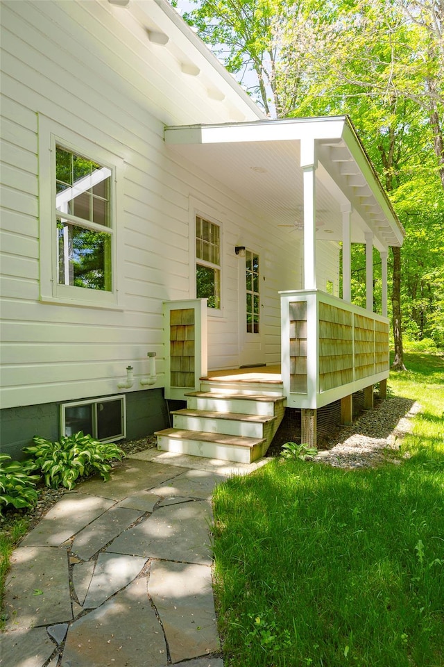 view of exterior entry with covered porch