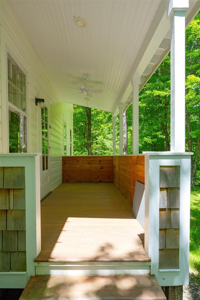 covered porch featuring ceiling fan