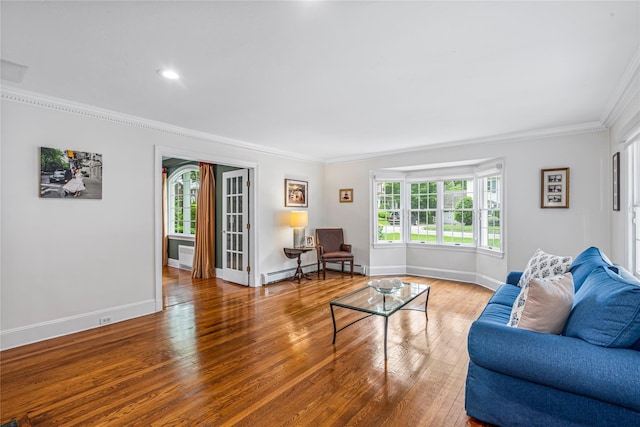 74 Eakins Rd, Manhasset, NY 11030 - living room featuring crown molding, a baseboard radiator, and wood finished floors