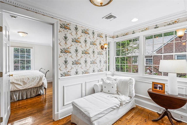74 Eakins Rd, Manhasset, NY 11030 - sitting room featuring wainscoting, ornamental molding, and wood finished floors
