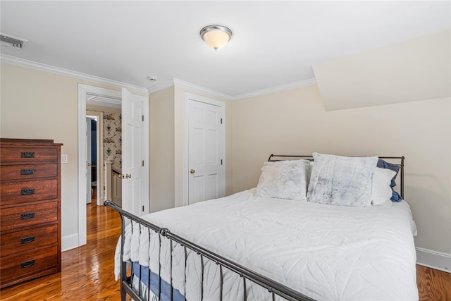 74 Eakins Rd, Manhasset, NY 11030 - bedroom featuring wood finished floors and ornamental molding