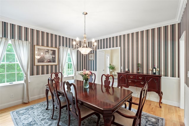 306 Mountain Rd, Pleasantville, NY 10570 - dining room featuring a chandelier, wallpapered walls, healthy amount of natural light, light wood-type flooring, and crown molding