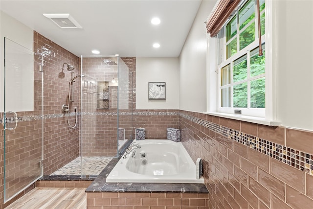 306 Mountain Rd, Pleasantville, NY 10570 - bathroom with a stall shower, a whirlpool tub, plenty of natural light, tile walls, and recessed lighting