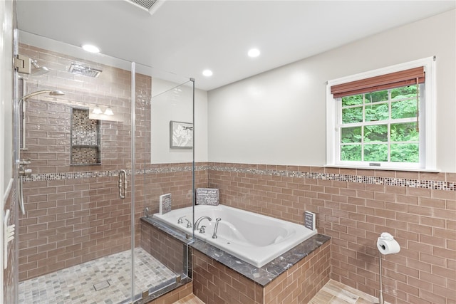 306 Mountain Rd, Pleasantville, NY 10570 - full bathroom featuring a bath, a stall shower, tile walls, recessed lighting, and wainscoting