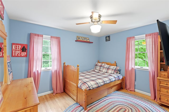 306 Mountain Rd, Pleasantville, NY 10570 - bedroom featuring multiple windows, light wood finished floors, and ceiling fan