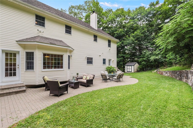 306 Mountain Rd, Pleasantville, NY 10570 - rear view of house with a storage shed, an outdoor living space, a patio, a chimney, and a yard