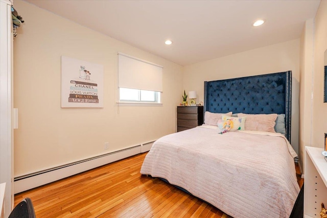2083 Oliver Way, Merrick, NY 11566 - bedroom with baseboard heating, light wood finished floors, and recessed lighting