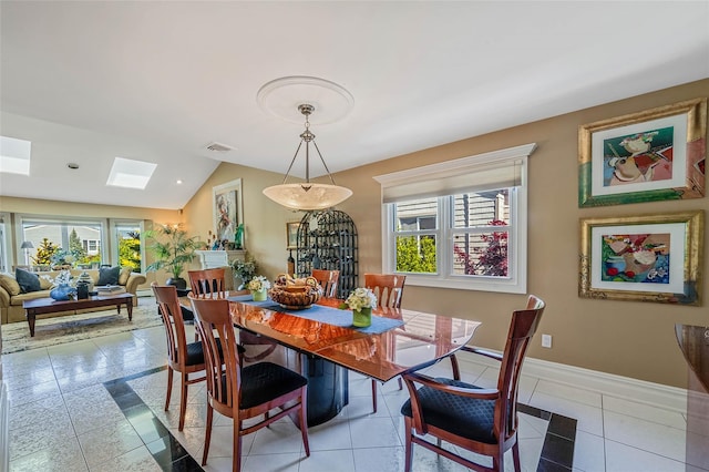 100 Mark Ln, Atlantic Beach, NY 11509 - tiled dining space with plenty of natural light, vaulted ceiling, baseboards, a skylight, and recessed lighting