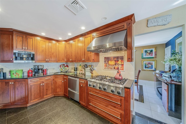 100 Mark Ln, Atlantic Beach, NY 11509 - kitchen with wall chimney exhaust hood, appliances with stainless steel finishes, decorative backsplash, dark countertops, and recessed lighting