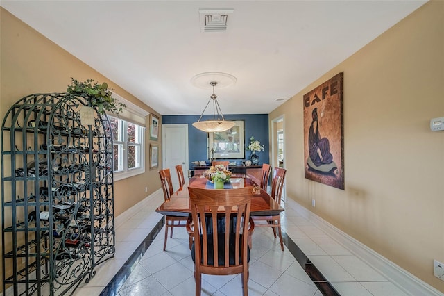 100 Mark Ln, Atlantic Beach, NY 11509 - dining space featuring inlaid floor details, plenty of natural light, and baseboards