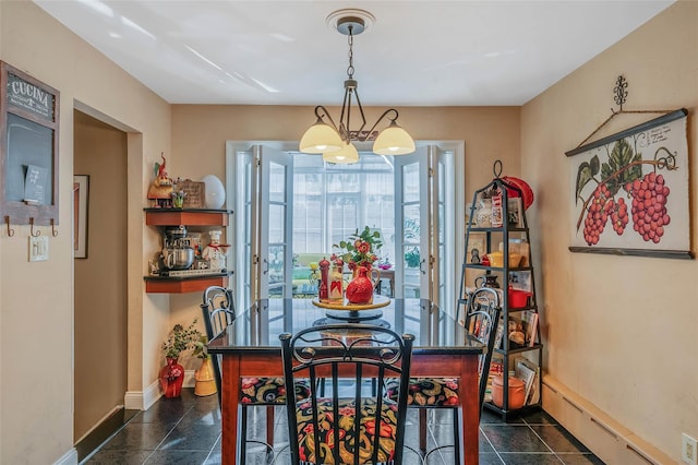 100 Mark Ln, Atlantic Beach, NY 11509 - dining space with a chandelier, baseboards, and a baseboard heating unit