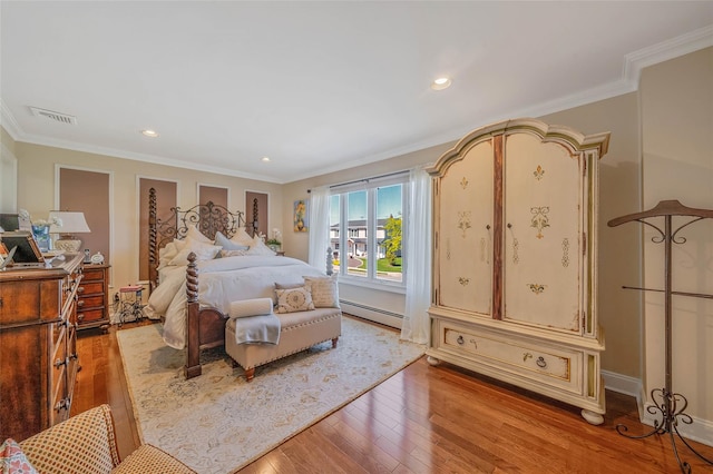 100 Mark Ln, Atlantic Beach, NY 11509 - bedroom featuring baseboard heating, light wood-type flooring, crown molding, and recessed lighting