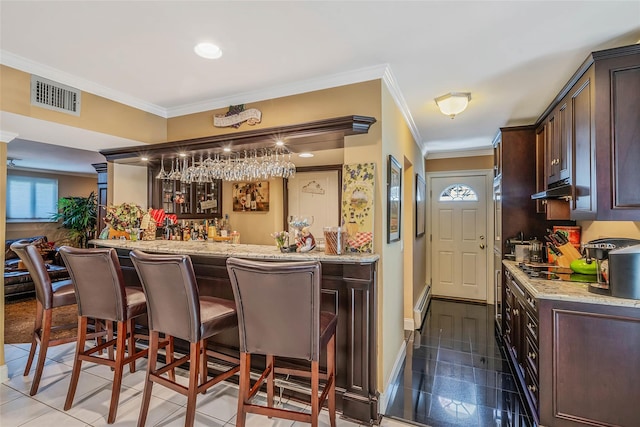 100 Mark Ln, Atlantic Beach, NY 11509 - indoor wet bar featuring ornamental molding, under cabinet range hood, and baseboards