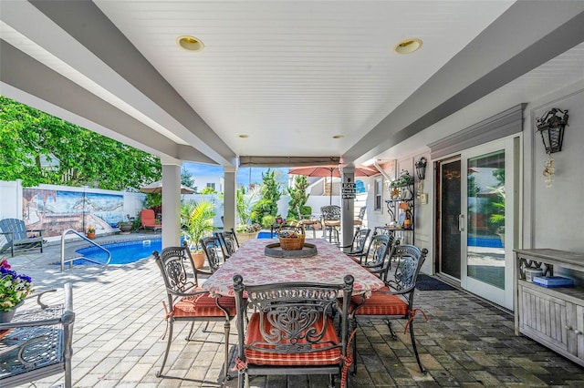 100 Mark Ln, Atlantic Beach, NY 11509 - fenced backyard with outdoor dining area and a patio