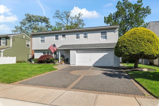 2406 Kayron Ln, North Bellmore, NY 11710 - traditional home featuring a garage and driveway