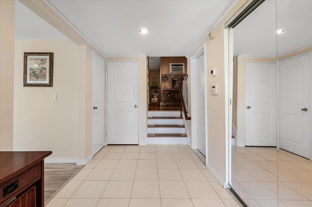 2406 Kayron Ln, North Bellmore, NY 11710 - hallway with baseboards, a wall unit AC, recessed lighting, stairway, and light tile patterned floors