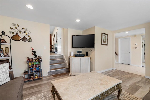 2406 Kayron Ln, North Bellmore, NY 11710 - living room featuring stairs, light wood-style floors, recessed lighting, and baseboards