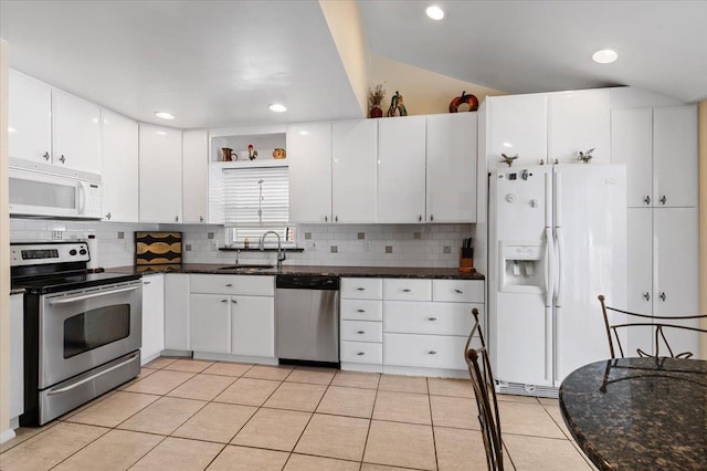 2406 Kayron Ln, North Bellmore, NY 11710 - kitchen featuring stainless steel appliances, a sink, tasteful backsplash, white cabinets, and recessed lighting