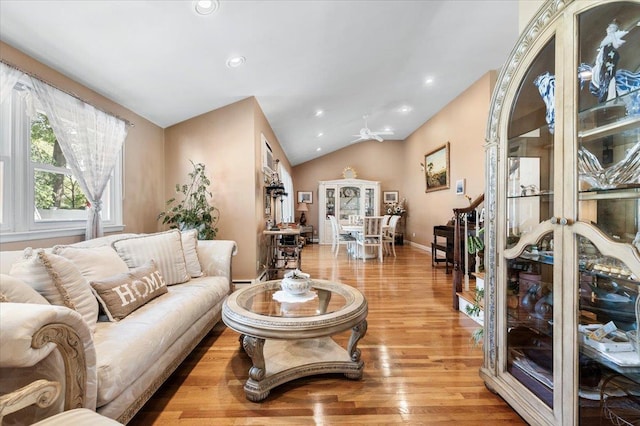 2406 Kayron Ln, North Bellmore, NY 11710 - living room featuring light wood-style flooring, vaulted ceiling, recessed lighting, and baseboards
