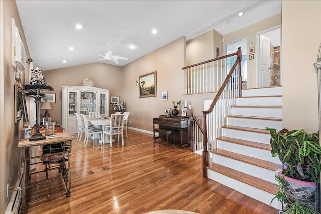 2406 Kayron Ln, North Bellmore, NY 11710 - dining room with wood finished floors, ceiling fan, stairway, vaulted ceiling, and recessed lighting