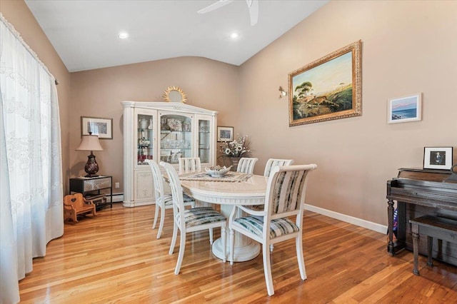 2406 Kayron Ln, North Bellmore, NY 11710 - dining space featuring vaulted ceiling, light wood-style floors, ceiling fan, baseboards, and recessed lighting
