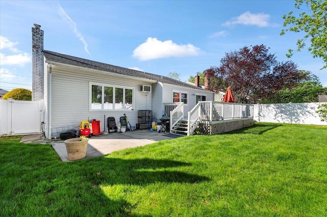 2406 Kayron Ln, North Bellmore, NY 11710 - rear view of house featuring a chimney, a wooden deck, a patio area, and a wall unit AC