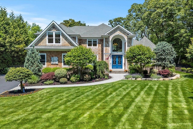 321 Sandpiper Dr, Riverhead, NY 11901 - view of front of house featuring a front yard and a shingled roof