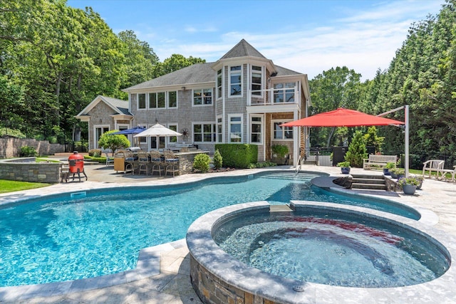 321 Sandpiper Dr, Riverhead, NY 11901 - view of swimming pool featuring a patio and a pool with connected hot tub