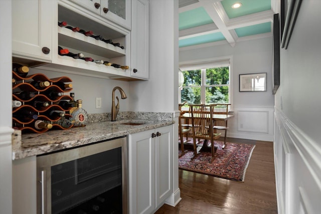 321 Sandpiper Dr, Riverhead, NY 11901 - indoor wet bar with freestanding refrigerator, beverage cooler, coffered ceiling, dark wood-style flooring, and beamed ceiling
